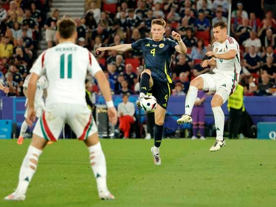 23 06 2024, European Football Championship, Scotland vs Hungary,MHP Stuttgart, Sport, in the picture Milos Kerkez Hungary , Scott McTominay Scotland , Willi Orban Hungary