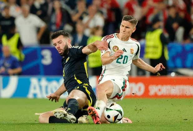 23 06 2024, European Football Championship, Scotland vs Hungary,MHP Stuttgart, Sport, in the picture Grant Hanley Scotland vs Roland Sallai Hungary