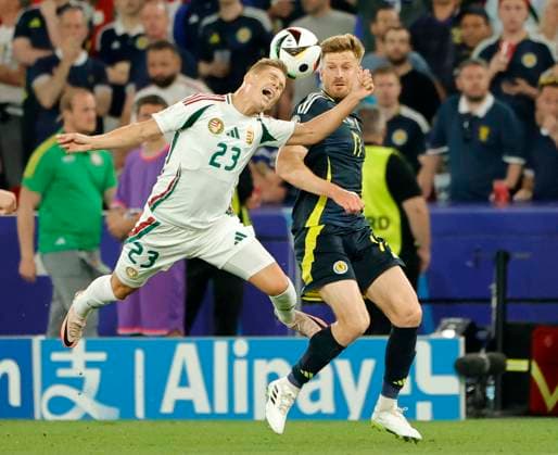 23 06 2024, European Football Championship, Scotland vs Hungary,MHP Stuttgart, Sport, in the picture Kevin Csoboth Hungary vs Greg Taylor Scotland