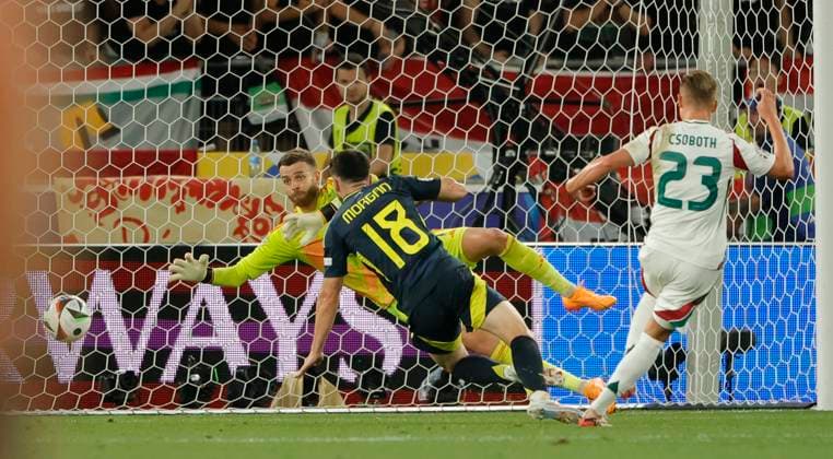 23 06 2024, European Football Championship, Scotland vs Hungary,MHP Stuttgart, Sport, in the picture 1 0 by Kevin Csoboth Hungary , Lewis Morgan Scotland and Angus Gunn Scotland are beaten