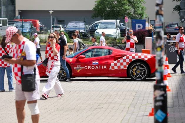PXL_CRO football fans Croatian football fans in Leipzig, Germany before UEFA EURO, EM, Europameisterschaft,Fussball 2024 football match Croatia - Italy on 24. June 2024. Ferrari in Croatian colours SanjinxStrukic PIXSELL