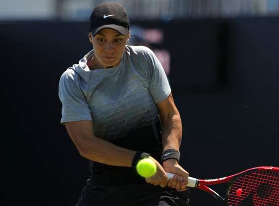 24th June 2024; Devonshire Park, Eastbourne, East Sussex, England: Rothesay International Eastbourne, Day 1, Anhelina Kalinina (UKR) plays a backhand against Sorana Cirstea (ROU) , womens singles match  ActionPlus12659791 HongboxChen