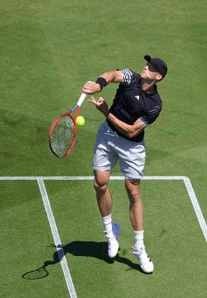 24th June 2024; Devonshire Park, Eastbourne, East Sussex, England: Rothesay International Eastbourne, Day 1; Billy Harris(GBR) plays a overhead shot against Jacob Fearnley (GBR), mens singles match  ActionPlus12659797 HongboxChen