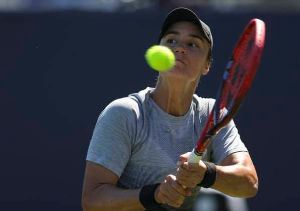 24th June 2024; Devonshire Park, Eastbourne, East Sussex, England: Rothesay International Eastbourne, Day 1, Anhelina Kalinina (UKR) plays a backhand against Sorana Cirstea (ROU) , womens singles match  ActionPlus12659784 HongboxChen