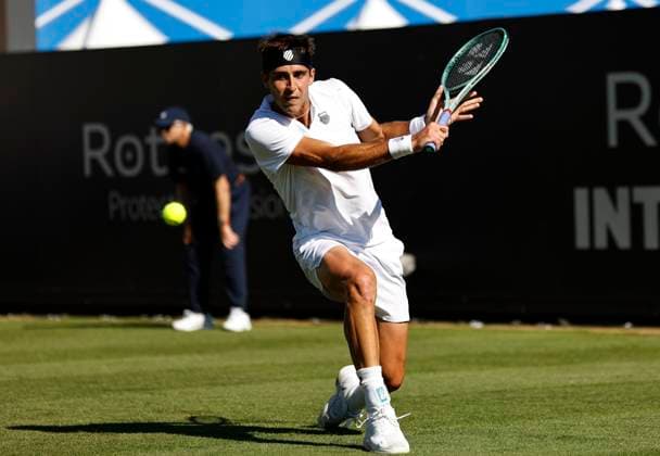 24th June 2024; Devonshire Park, Eastbourne, East Sussex, England: Rothesay International Eastbourne, Day 1; Tomas Martin Etchverry (ARG) plays a backhand against Juncheng Shang (CHN)  ActionPlus12660035 HongboxChen