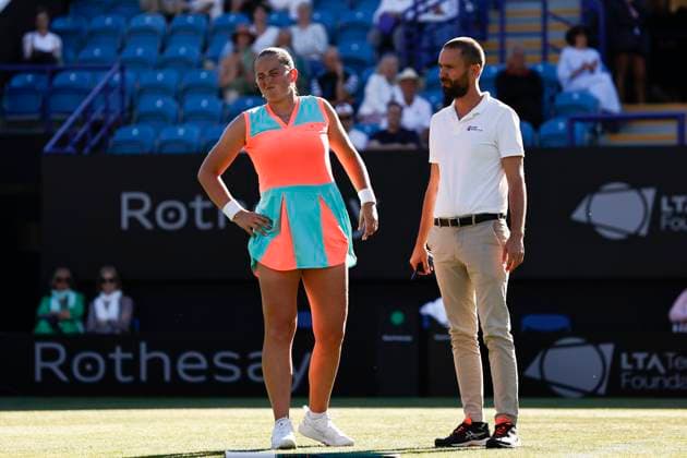 24th June 2024; Devonshire Park, Eastbourne, East Sussex, England: Rothesay International Eastbourne, Day 1, A tournament offical checks Jelena Ostapenko (LAT) after her fall during the match against Greet Minnen (BEL)  ActionPlus12660059 HongboxChen