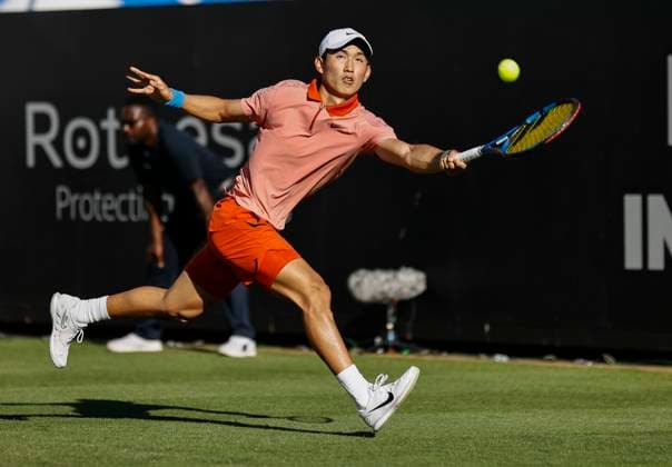 24th June 2024; Devonshire Park, Eastbourne, East Sussex, England: Rothesay International Eastbourne, Day 1; Juncheng Shang (CHN) plays a forehand against Tomas Martin Etchverry (ARG)  ActionPlus12660060 HongboxChen