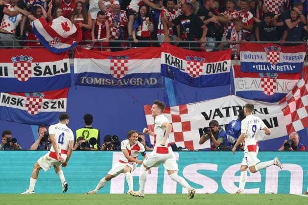 Luka Modric of Croatia celebrates their goal to make it 1-0 Croatia v Italy, UEFA European Championship, EM, Europameisterschaft 2024, Group B, Football, Leipzig Stadium, Leipzig, Germany, 24 Jun 2024 EDITORIAL USE ONLY No use with unauthorised audio, video, data, fixture lists, club league logos or live services. Online in-match use limited to 120 images, no video emulation. No use in betting, games or single club league player publications. Copyright: xMattxWest Shutterstockx 14551036bx
