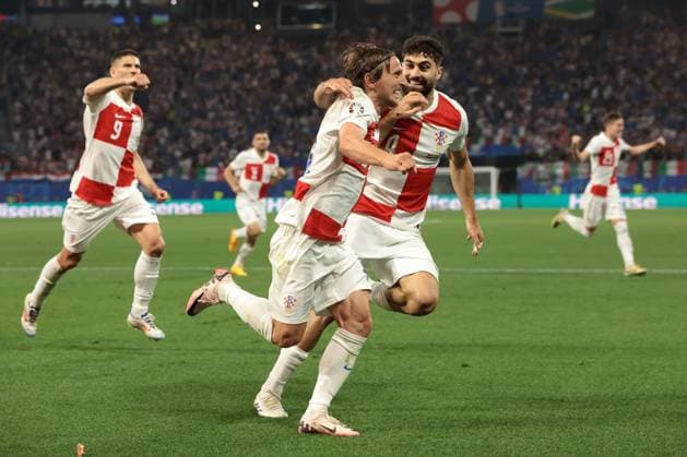 Leipzig, Germany, 24th June 2024. Luka Modric of Croatia celebrates with team mates after scoring to give the side a 1-0 lead during the UEFA European Championships match at Leipzig Stadium, Leipzig. Picture credit should read: Jonathan Moscrop Sportimage EDITORIAL USE ONLY. No use with unauthorised audio, video, data, fixture lists, club league logos or live services. Online in-match use limited to 120 images, no video emulation. No use in betting, games or single club league player publications. SPI-3190-0012