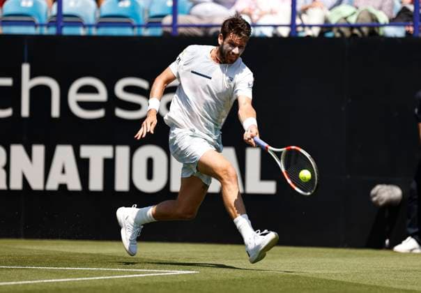 25th June 2024; Devonshire Park, Eastbourne, East Sussex, England: Rothesay International Eastbourne, Day 2; Cameron Norrie (GBR) plays a forehand against Emil Ruusuvuori (Fin) mens singles  ActionPlus12660304 HongboxChen