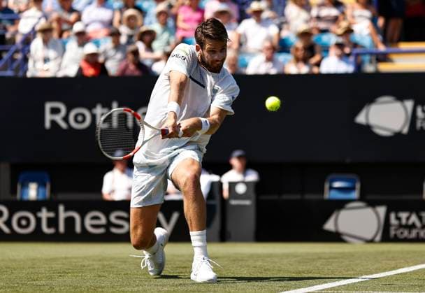 25th June 2024; Devonshire Park, Eastbourne, East Sussex, England: Rothesay International Eastbourne, Day 2; Cameron Norrie (GBR) plays a backhand against Emil Ruusuvuori (Fin) mens singles  ActionPlus12660310 HongboxChen