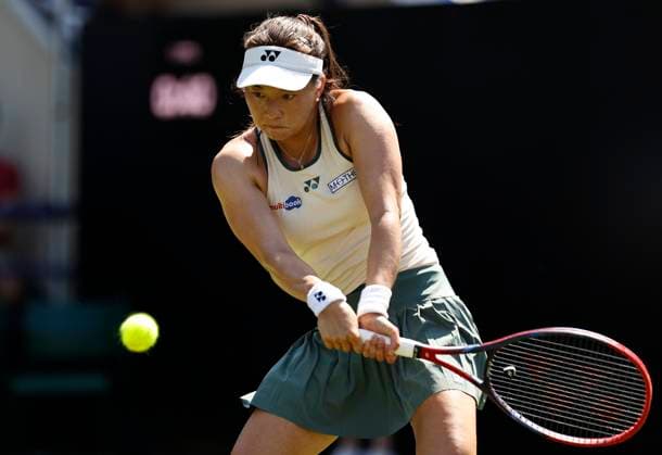 25th June 2024; Devonshire Park, Eastbourne, East Sussex, England: Rothesay International Eastbourne, Day 2, Yuriko Miyazaki (GBR) plays a backhand against Elise Mertens (BEL) womens singles  ActionPlus12660320 HongboxChen