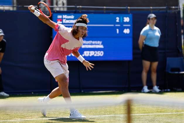 25th June 2024; Devonshire Park, Eastbourne, East Sussex, England: Rothesay International Eastbourne, Day 2; Zhizhen Zhang (CHN) plays a backhand against Miomir Kecmanovic (SRB) mens singles  ActionPlus12660376 HongboxChen