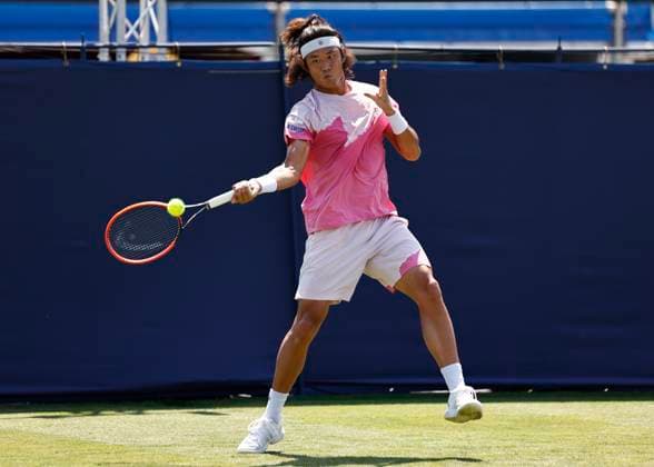 25th June 2024; Devonshire Park, Eastbourne, East Sussex, England: Rothesay International Eastbourne, Day 2; Zhizhen Zhang (CHN) plays a forehand against Miomir Kecmanovic (SRB) mens singles  ActionPlus12660378 HongboxChen