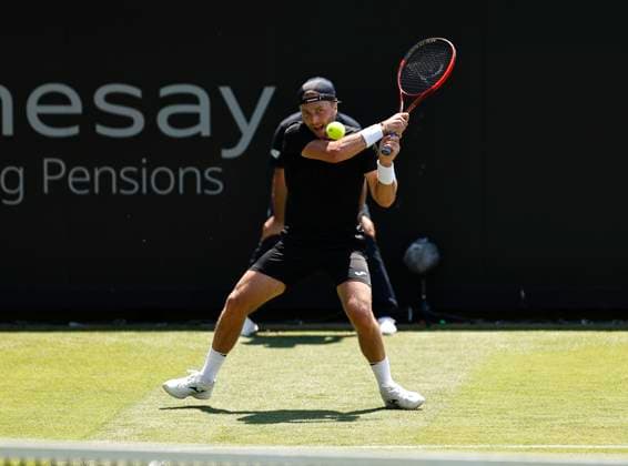 25th June 2024; Devonshire Park, Eastbourne, East Sussex, England: Rothesay International Eastbourne, Day 2; Liam Broady (GBR) plays a backhand against Yoshihito Nishioka (JPN) mens singles  ActionPlus12660364 HongboxChen