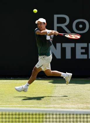 25th June 2024; Devonshire Park, Eastbourne, East Sussex, England: Rothesay International Eastbourne, Day 2; Yoshihito Nishioka (JPN) plays a backhand against Liam Broady (GBR) mens singles  ActionPlus12660368 HongboxChen