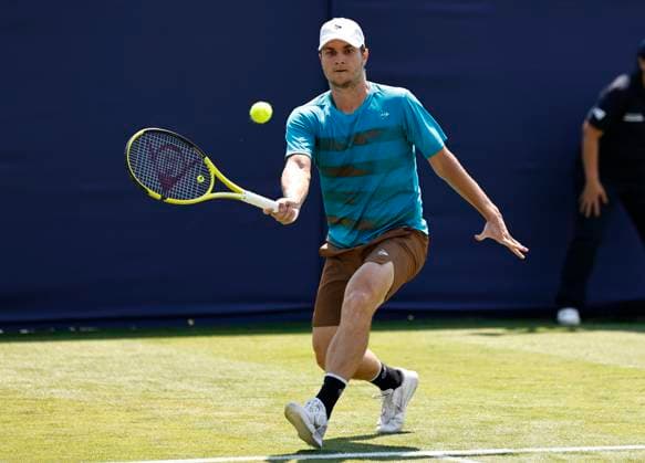 25th June 2024; Devonshire Park, Eastbourne, East Sussex, England: Rothesay International Eastbourne, Day 2; Miomir Kecmanovic (SRB) plays a forehand against Zhizhen Zhang (CHN) mens singles  ActionPlus12660381 HongboxChen