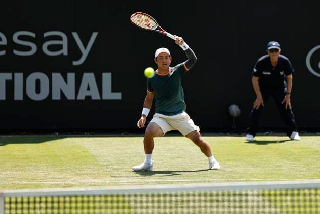 25th June 2024; Devonshire Park, Eastbourne, East Sussex, England: Rothesay International Eastbourne, Day 2; Yoshihito Nishioka (JPN) plays a forehand against Liam Broady (GBR)  ActionPlus12660370 HongboxChen