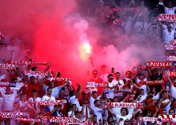 Polish fans light flares prior to kick off France v Poland, UEFA European Championship, EM, Europameisterschaft 2024, Group D, Football, BVB Stadion, Dortmund, Germany, 25 Jun 2024 EDITORIAL USE ONLY No use with unauthorised audio, video, data, fixture lists, club league logos or live services. Online in-match use limited to 120 images, no video emulation. No use in betting, games or single club league player publications. Copyright: xPaulxCurrie Shutterstockx 14555523be