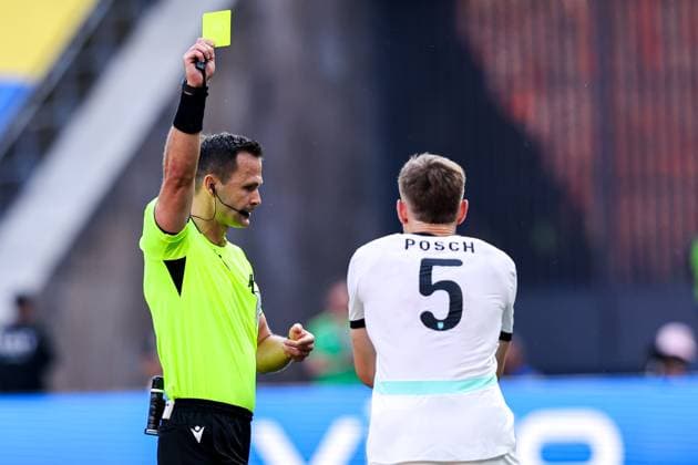 2024-06-25 Netherlands v Austria - Group D - UEFA EURO, EM, Europameisterschaft,Fussball 2024 BERLIN, GERMANY - JUNE 25: Referee Ivan Kruzliak shows a yellow card to Stefan Posch of Austria during the Group D - UEFA EURO 2024 match between Netherlands and Austria at Olympiastadion on June 25, 2024 in Berlin, Germany. (Photo by Peter Lous BSR Agency) Berlin Germany Content not available for redistribution in The Netherlands directly or indirectly through any third parties. Copyright: xBSRxAgencyx