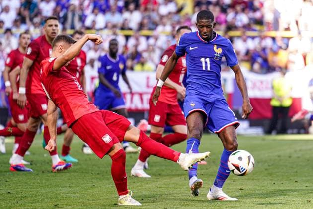 2024-06-25 France v Poland - Group D - UEFA EURO, EM, Europameisterschaft,Fussball 2024 DORTMUND, GERMANY - JUNE 25: Przemyslaw Frankowski of Poland shoots the ball as Ousmane Dembele of France tries to stop him during the Group D - UEFA EURO 2024 match between France and Poland at BVB Stadion Dortmund on June 25, 2024 in Dortmund, Germany. (Photo by Joris Verwijst BSR Agency) Dortmund Germany Content not available for redistribution in The Netherlands directly or indirectly through any third parties. Copyright: xBSRxAgencyx