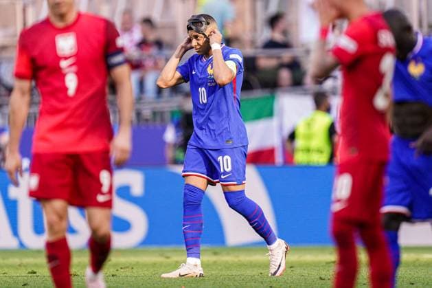 2024-06-25 France v Poland - Group D - UEFA EURO, EM, Europameisterschaft,Fussball 2024 DORTMUND, GERMANY - JUNE 25: Kylian Mbappe of France takes off his mask and celebrates the first goal during the Group D - UEFA EURO 2024 match between France and Poland at BVB Stadion Dortmund on June 25, 2024 in Dortmund, Germany. (Photo by Joris Verwijst BSR Agency) Dortmund Germany Content not available for redistribution in The Netherlands directly or indirectly through any third parties. Copyright: xBSRxAgencyx