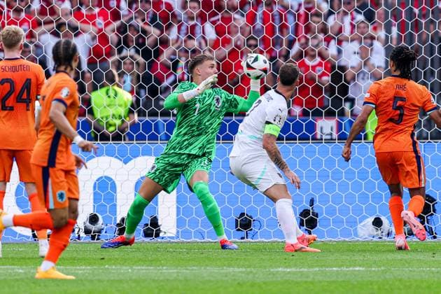 2024-06-25 Netherlands v Austria - Group D - UEFA EURO, EM, Europameisterschaft,Fussball 2024 BERLIN, GERMANY - JUNE 25: Marko Arnautovic of Austria has a shot onto the goal, Bart Verbruggen of the Netherlands deflecting during the Group D - UEFA EURO 2024 match between Netherlands and Austria at Olympiastadion on June 25, 2024 in Berlin, Germany. (Photo by Peter Lous BSR Agency) Berlin Germany Content not available for redistribution in The Netherlands directly or indirectly through any third parties. Copyright: xBSRxAgencyx