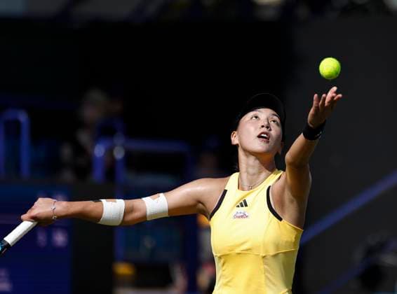 25th June 2024; Devonshire Park, Eastbourne, East Sussex, England: Rothesay International Eastbourne, Day 2, Xinyu Wang (CHN) serves to Daria Kasatkina , womens singles match  ActionPlus12660482 HongboxChen