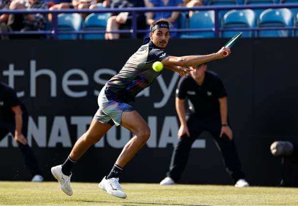 25th June 2024; Devonshire Park, Eastbourne, East Sussex, England: Rothesay International Eastbourne, Day 2; Lorenzo Sonego (ITA) plays a backhand against Henry Searle (GBR) , mens singles match  ActionPlus12660509 HongboxChen