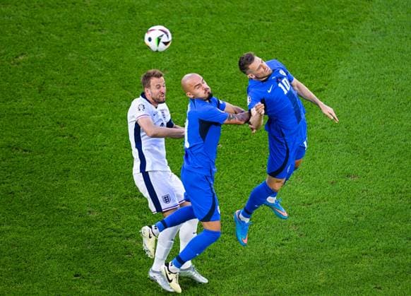 Harry Kane England , Timi Elsnik Slovenia and Vanja Drkusic Slovenia battle for the ball, UEFA EURO 2024 Group C, England vs Slovenia, Cologne Stadium on June 25, 2024 in Cologne, Germany Photo by Silas Schueller DeFodi Images Harry Kane England , Timi Elsnik Slovenia and Vanja Drkusic Slovenia battle for the ball, UEFA EURO 2024 Group C, England vs Slovenia, Cologne Stadium on June 25, 2024 in Cologne, Germany Photo by Silas Schueller DeFodi Images Defodi 738 738 ENGSVN 20240625 154 Defodi-738