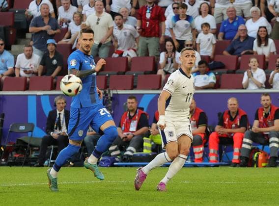 England v Slovenia UEFA EURO, EM, Europameisterschaft,Fussball 2024 Group C Phil Foden of England and Vanja DrkuÅ¡iÄ? of Slovenia during the UEFA Euro 2024 Group C match between England and Slovenia at RheinEnergieStadion, Cologne Copyright: xPaulxChestertonx FIL-20274-0072 UK Newspapers OUT