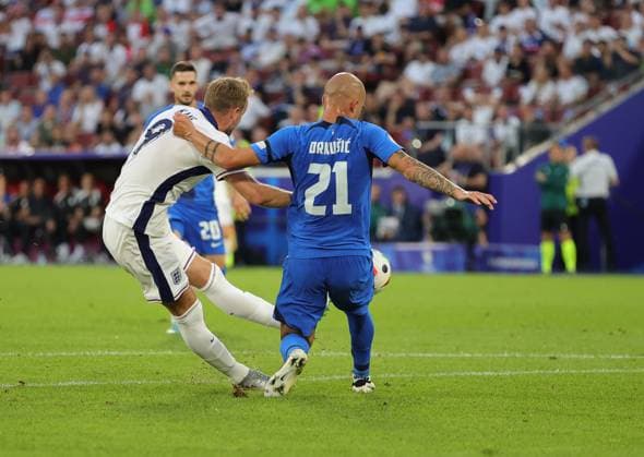 England v Slovenia UEFA EURO, EM, Europameisterschaft,Fussball 2024 Group C Harry Kane of England gets his shot away past Vanja DrkuÅ¡iÄ? of Slovenia during the UEFA Euro 2024 Group C match between England and Slovenia at RheinEnergieStadion, Cologne Copyright: xPaulxChestertonx FIL-20274-0102 UK Newspapers OUT