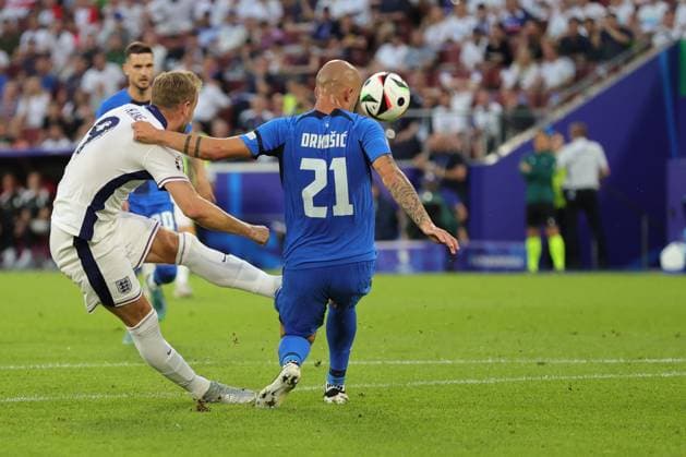 England v Slovenia UEFA EURO, EM, Europameisterschaft,Fussball 2024 Group C Harry Kane of England gets his shot away past Vanja DrkuÅ¡iÄ? of Slovenia during the UEFA Euro 2024 Group C match between England and Slovenia at RheinEnergieStadion, Cologne Copyright: xPaulxChestertonx FIL-20274-0103 UK Newspapers OUT