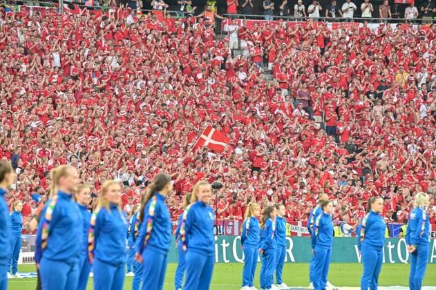 Picture shows Danish fans during the national anthem, 25 06 2024, Munich, Football, European Championship, Denmark Serbia, EVENT REGULATIONS PROHIBIT ANY USE OF PHOTOGRAPHS AS IMAGE SEQUENCES AND OR QUASI VIDEO xklx