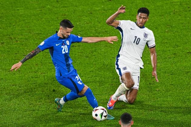 COLOGNE - (l-r) Petar Stojanovic of Slovenia, Jude Bellingham of England during the UEFA EURO, EM, Europameisterschaft,Fussball 2024 group C match between England and Slovenia at the Rhein Energie stadium on June 25, 2024 in Cologne, Germany. ANP Hollandse Hoogte UEFA EURO 2024 2024 xVIxANPxSportx xGerritxvanxKeulenxIVx 502060345 originalFilename: 502060345.jpg