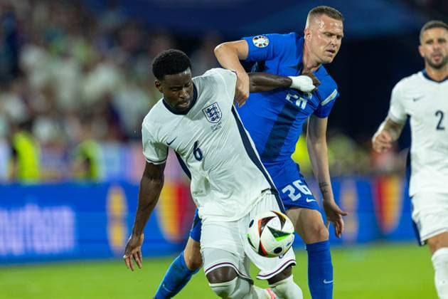 Football - UEFA EURO, EM, Europameisterschaft,Fussball 2024 - Group C - England v Slovenia COLOGNE, GERMANY - Tuesday, June 25, 2024: England s Marc GuÃ hi (L) is challenged by Slovenia s Josip IliÄiÄ‡ during the UEFA Euro 2024 Group C match between England and Slovenia at the Müngersdorfer Stadium. (Photo by David Rawcliffe Propaganda) COLOGNE Müngersdorfer Stadium NORTH RHINE-WESTPHALIA GERMANY  Copyright: xDavidxRawcliffex P2024-06-25-England_Slovenia-71