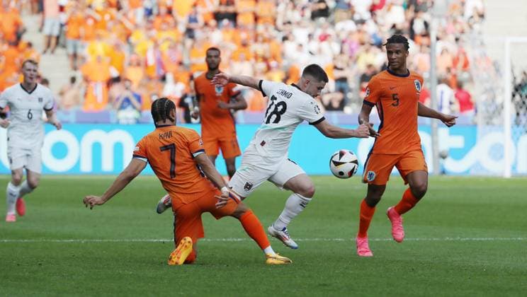 Xavi Simons, Romano Schmid, Nathan Ake duel Match scene Action Sport Football Soccer European Championship Euro 2024 European Championship Men Season 2023 2024 25 06 2024 Netherlands NED vs Austria AUT in Berlin DFL regulations prohibit any use of photographs as image sequences and or quasi video