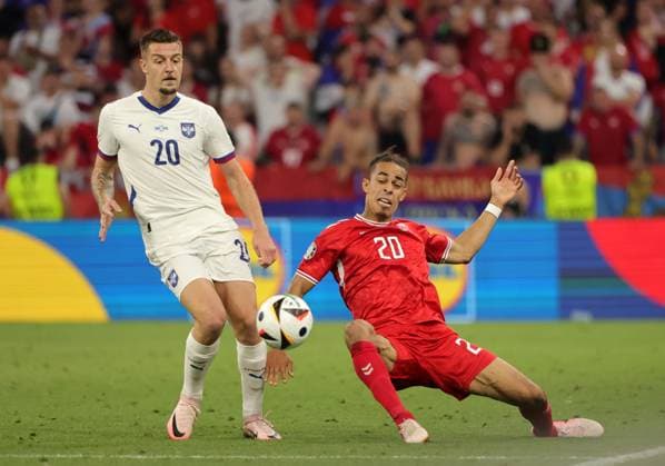 (240626) -- MUNICH, June 26, 2024 -- Yussuf Poulsen (R) of Denmark vies with Sergej Milinkovic-Savic of Serbia during the UEFA EURO, EM, Europameisterschaft,Fussball 2024 Group C match between Denmark and Serbia in Munich, Germany, June 25, 2024. (Photo by Xinhua) (SP)GERMANY-MUNICH-FOOTBALL-EURO 2024-DENMARK VS SERBIA PhilippexRuiz 