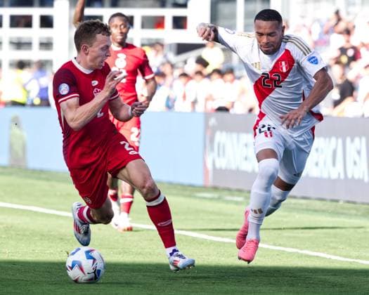 June 25, 2024, Kansas City, Kansas, USA: Team Peru and Team Canada compete in the CONMEBOL Men s Division Group Match at Copa America held at Children s Mercy Park in Kansas City, KS, on June 25, 2024. Pictured is Team Canada defender Alistair Johnston 2 (l) battling for the defense against Team Peru defender Alexander Callens 22 (r) during the second half of the game. Kansas City USA - ZUMAh139 20240625_zap_h139_008 Copyright: xSerenaxS.Y.xHsux