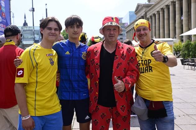 Belgian and Ukrainian supporters pictured in the city center, near the fan zone village, in the afternoon before a soccer game between Ukraine and Belgian national soccer team Red Devils, Wednesday 26 June 2024 in Stuttgart, Germany, the third match in the group stage of the UEFA EURO, EM, Europameisterschaft,Fussball 2024 European championships. In the group E, the four teams have three points before the last game, it is the first time this happens at Euro. DIRKxWAEM x95305137x
