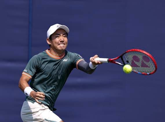 26th June 2024; Devonshire Park, Eastbourne, East Sussex, England: Rothesay International Eastbourne, Day 3; Yoshihito Nishioka (JPN) plays a forehand against Marcos Giron (USA) , mens singles match  ActionPlus12660713 HongboxChen
