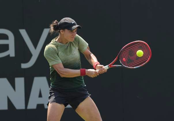 26th June 2024; Devonshire Park, Eastbourne, East Sussex, England: Rothesay International Eastbourne, Day 3, Anhelina Kalinina (UKR) plays a backhand against Madison Keys (USA) , womens singles match  ActionPlus12660694 HongboxChen
