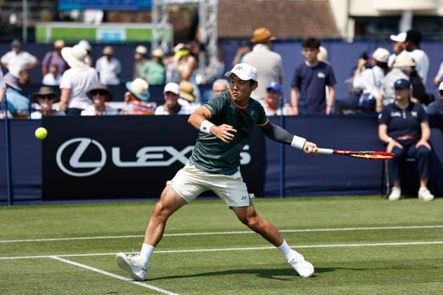 26th June 2024; Devonshire Park, Eastbourne, East Sussex, England: Rothesay International Eastbourne, Day 3; Yoshihito Nishioka (JPN) plays a forehand against Marcos Giron (USA) , mens singles match  ActionPlus12660723 HongboxChen