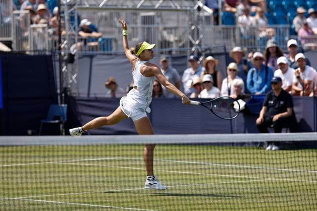 26th June 2024; Devonshire Park, Eastbourne, East Sussex, England: Rothesay International Eastbourne, Day 3, Magda Linette (POL) plays a backhand against Karolina Muchova (CZE) , womens singles match  ActionPlus12660729 HongboxChen