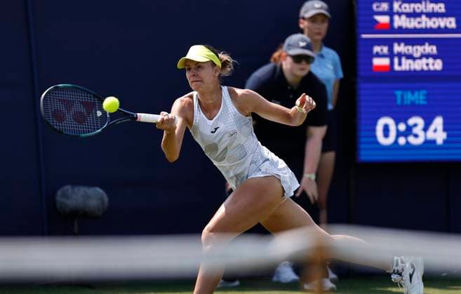 26th June 2024; Devonshire Park, Eastbourne, East Sussex, England: Rothesay International Eastbourne, Day 3, Magda Linette (POL) plays a backhand against Karolina Muchova (CZE) , womens singles match  ActionPlus12660732 HongboxChen