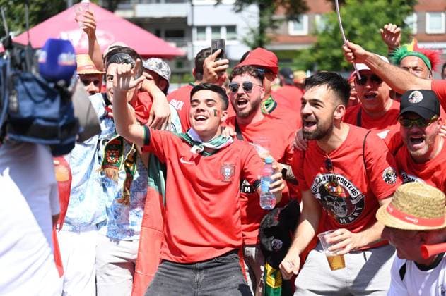 Soccer Euro 2024 in Gelsenkirchen FOR EDITORIAL PURPOSES ONLY p Fans celebrate the teams of Portugal and Georgia on Wednesday, 26 6 2024 in Gelsenkirchen before the match of the European Football Championship in the Veltins Arena Germany NRW Gelsenkirchen Copyright IngoxOtto Copyright: IngoxOtto doc7w1d2m4eu529j1ja79d ,EDITORIAL USE ONLY Copyright: IngoxOtto