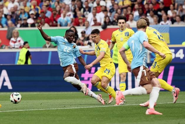 Belgium s Jeremy Doku and Ukraine s Oleksandr Tymchyk pictured in action during a soccer game between Ukraine and Belgian national soccer team Red Devils, Wednesday 26 June 2024 in Stuttgart, Germany, the third match in the group stage of the UEFA EURO, EM, Europameisterschaft,Fussball 2024 European championships. DIRKxWAEM  x95323183x