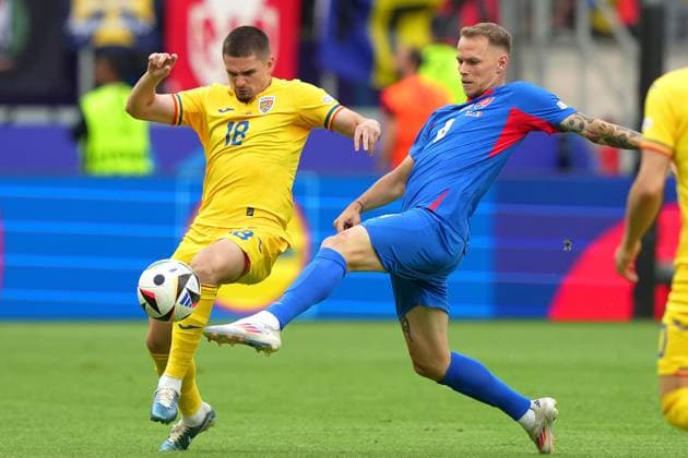 Romania s Ianis Hagi ight for the ball with Slovakia s Ondrej Duda during the Euro 2024 soccer match between Slovakia and Romania at the Frankfurt Arena , Frankfurt , Germany - Wednesday 26 June 2024. - Soccer .  Copyright: xSpada LaPressex