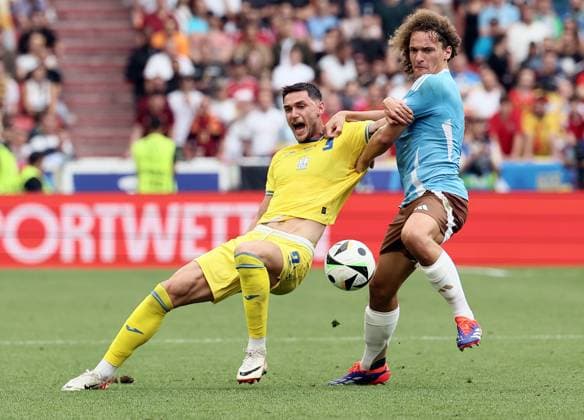 Ukraine s Mykola Shaparenko and Belgium s Wout Faes fight for the ball during a soccer game between Ukraine and Belgian national soccer team Red Devils, Wednesday 26 June 2024 in Stuttgart, Germany, the third match in the group stage of the UEFA EURO, EM, Europameisterschaft,Fussball 2024 European championships. BRUNOxFAHY  x95324710x