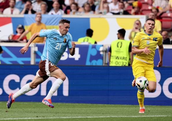 Belgium s Timothy Castagne and Ukraine s Vitaliy Mykolenko pictured during a soccer game between Ukraine and Belgian national soccer team Red Devils, Wednesday 26 June 2024 in Stuttgart, Germany, the third match in the group stage of the UEFA EURO, EM, Europameisterschaft,Fussball 2024 European championships. BRUNOxFAHY  x95328635x